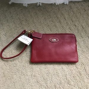 Coach wristlet. Tags attached. Red leather
